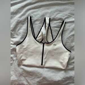 ALO Supernova Zip Bodysuite in White and Black colour.